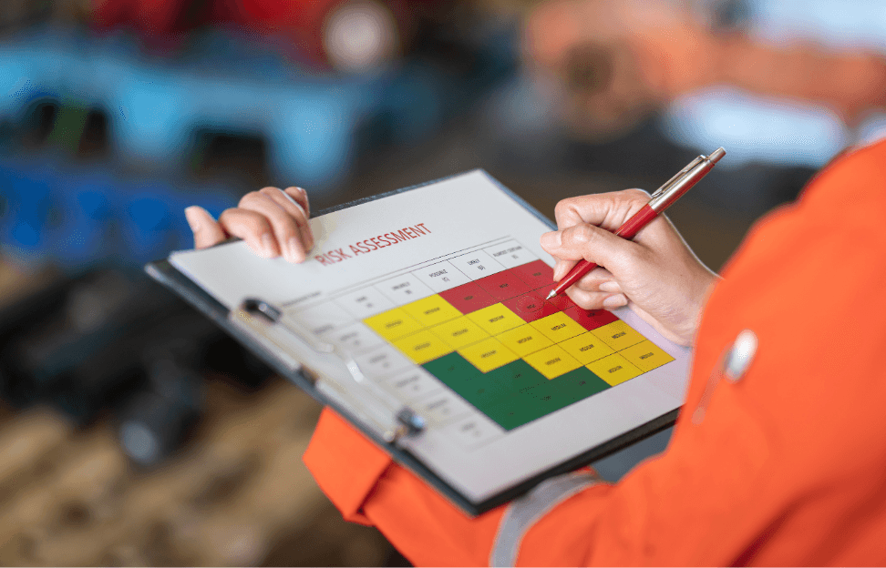 manager-is-using-ballpoint-pen-marking-risk-assessment-matrix-high-risk-level